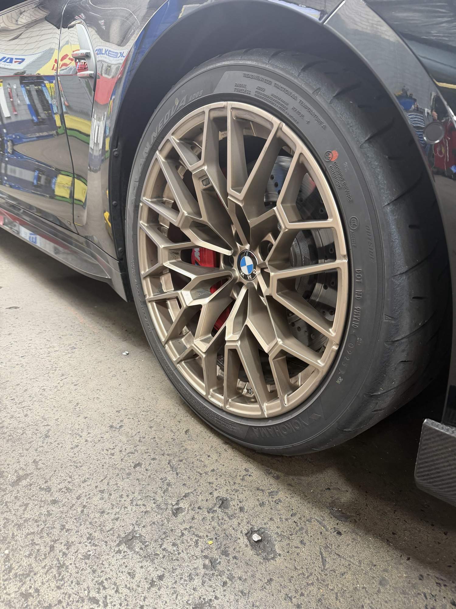 Bronze alloy wheel and low profile tyre on a BMW in the Hornsby Car Care workshop